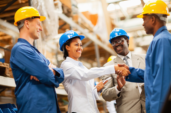 warehouse manager shaking hands with warehouse worker warehouse manager shaking hands with warehouse worker